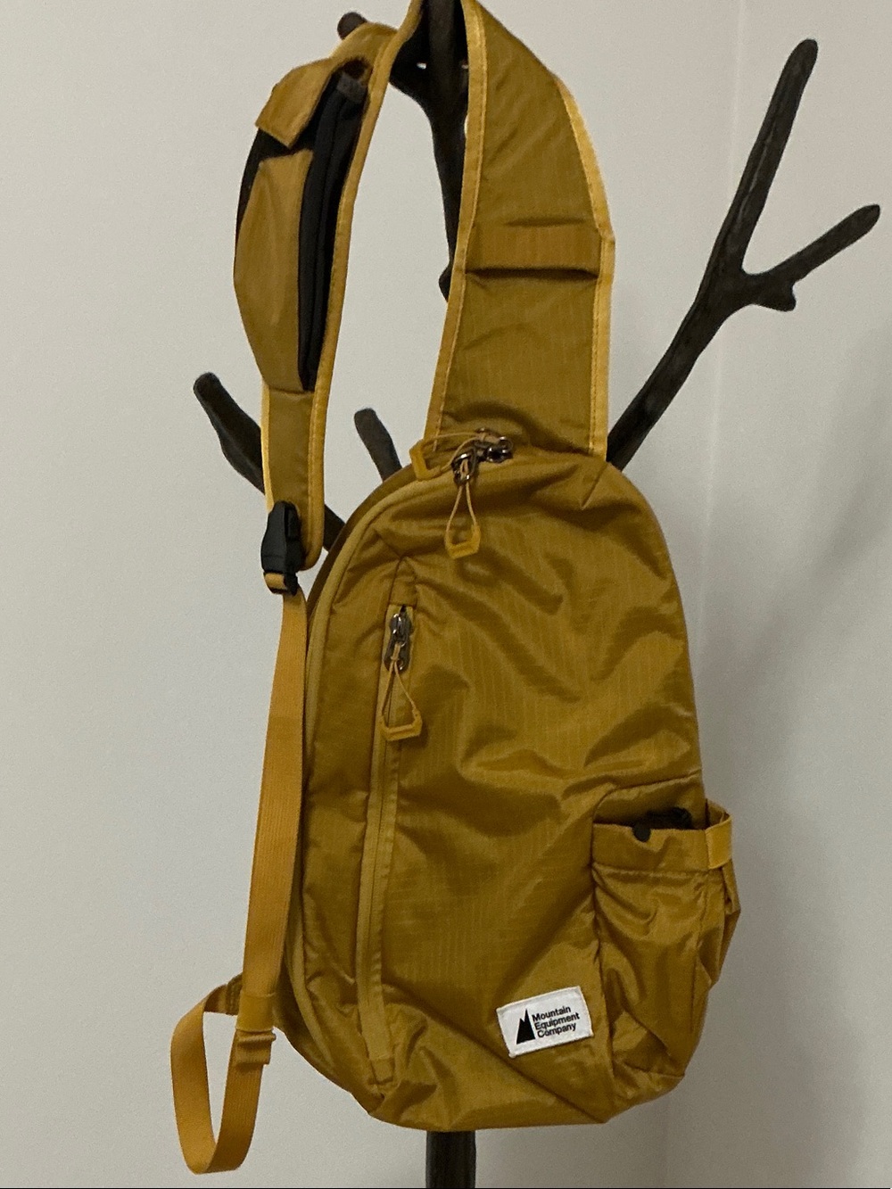 Mountain Equipment Company golden-yellow sling bag